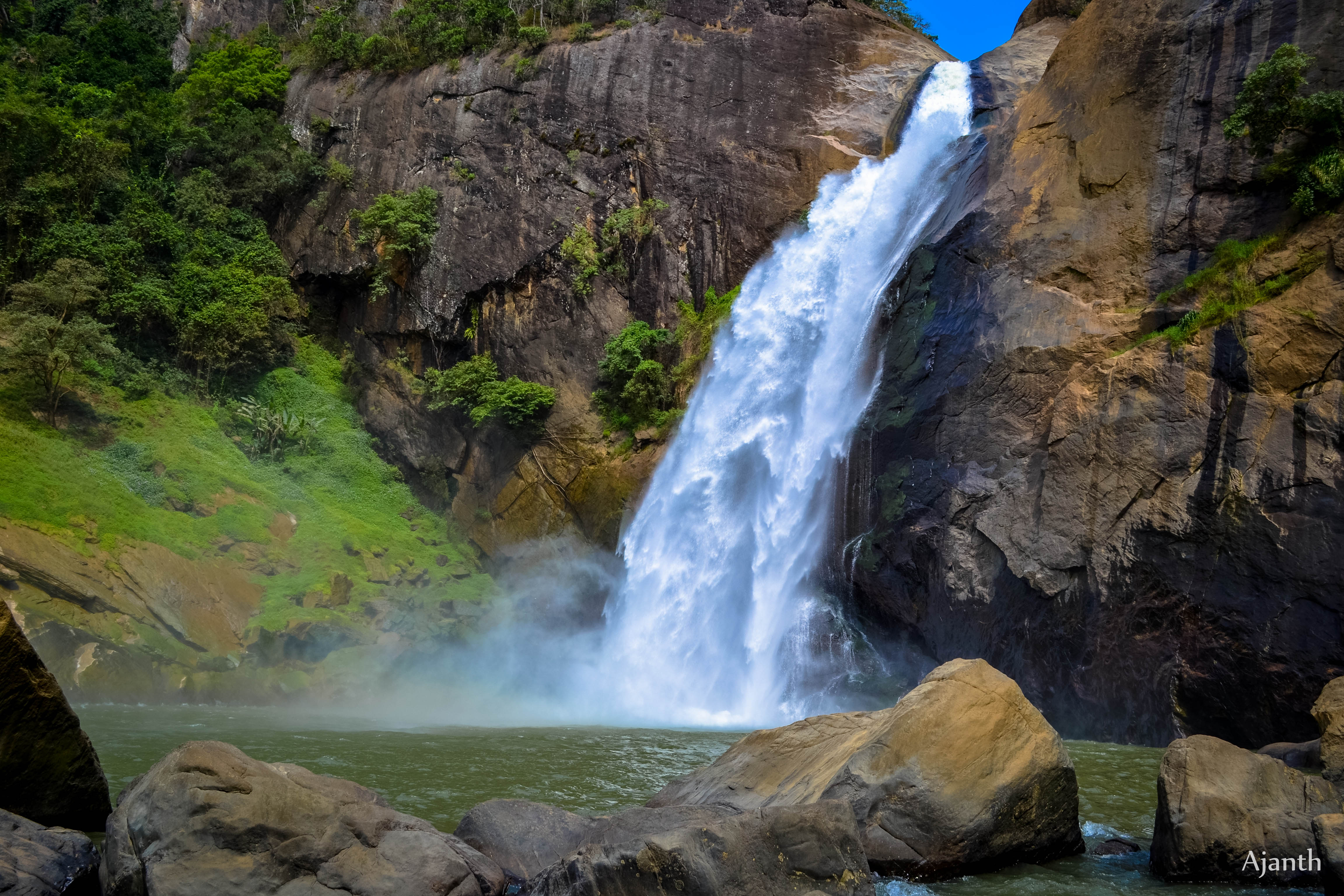 Stunning 63-meter Diyaluma waterfall cascading through lush Sri Lankan tropical rainforest
